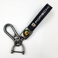 Sleek Black Leather Keychain with Eye-Catching Emblem & Secure Carabiner
